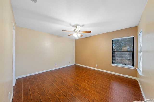 spare room featuring ceiling fan and hardwood / wood-style floors