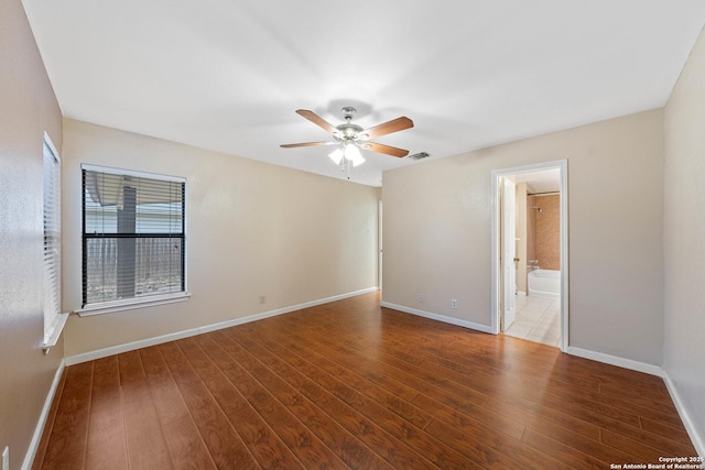 unfurnished room with ceiling fan and wood-type flooring