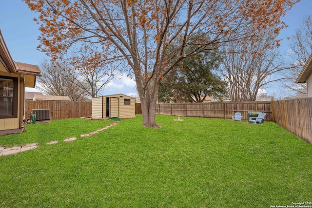 view of yard with central AC unit and a storage unit