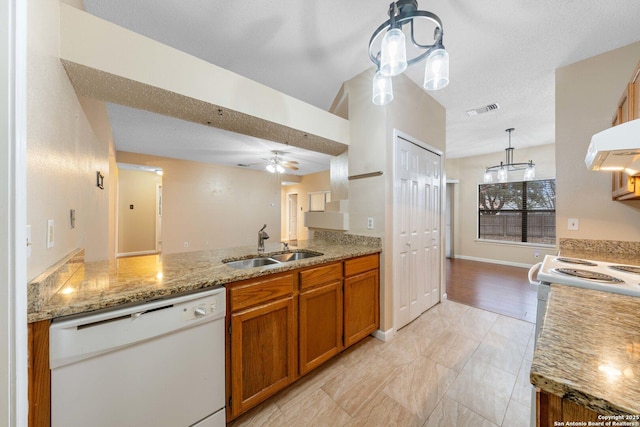 kitchen with pendant lighting, dishwasher, sink, ventilation hood, and kitchen peninsula