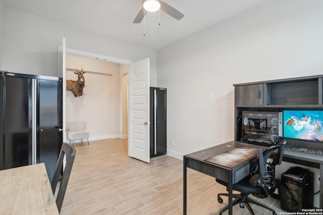 office featuring ceiling fan and light hardwood / wood-style floors