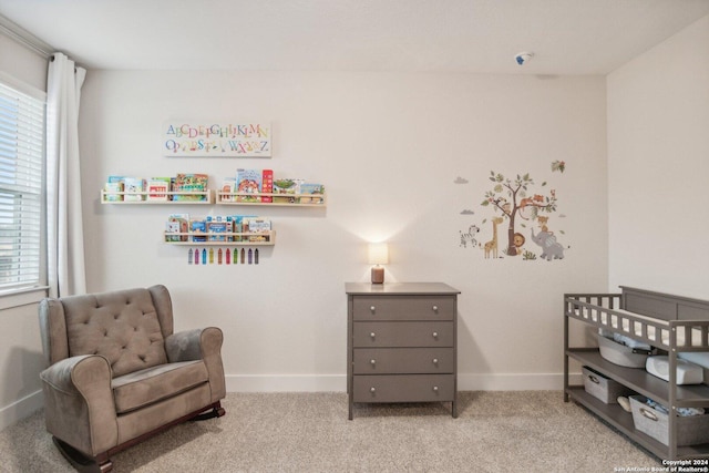 living area featuring plenty of natural light and light carpet