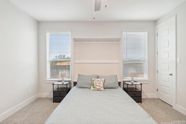 carpeted bedroom with ceiling fan