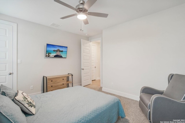 bedroom featuring light carpet and ceiling fan