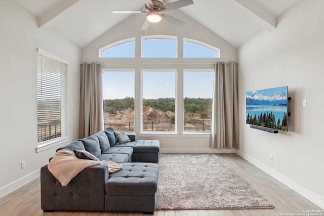 living room with ceiling fan, a healthy amount of sunlight, and light hardwood / wood-style floors