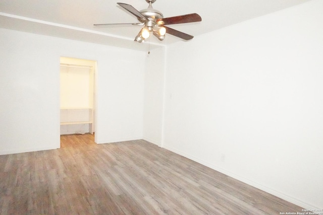 unfurnished room with ceiling fan and light hardwood / wood-style floors