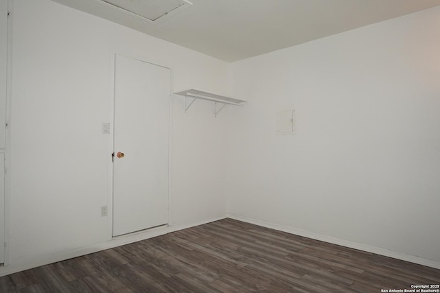 spacious closet with dark hardwood / wood-style floors