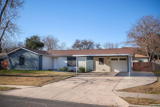 ranch-style home with a front yard and a garage