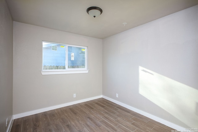 spare room featuring hardwood / wood-style floors