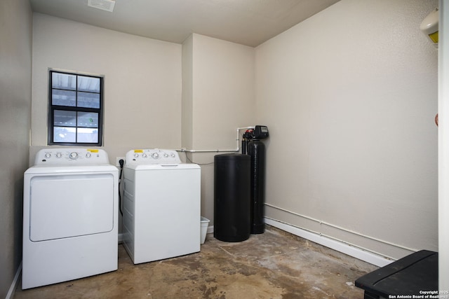 clothes washing area featuring independent washer and dryer