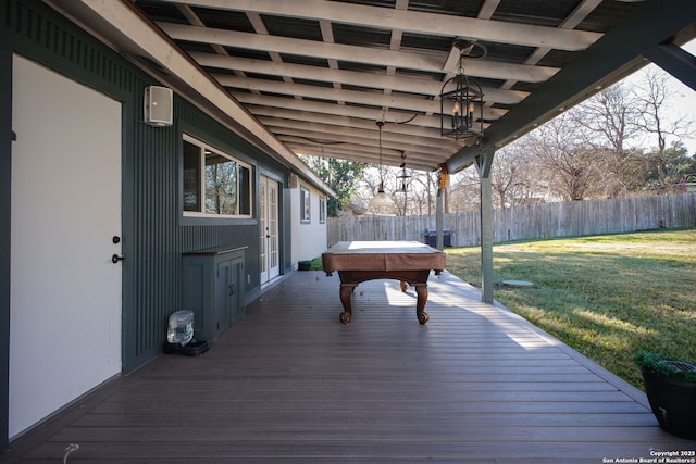 deck featuring a jacuzzi and a yard