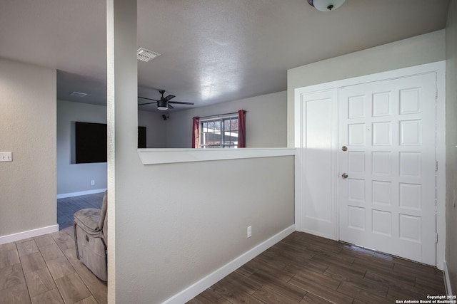 corridor featuring dark hardwood / wood-style flooring