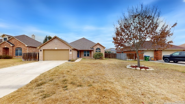 ranch-style house featuring a garage and a front yard