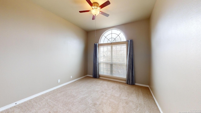 carpeted empty room with ceiling fan and lofted ceiling