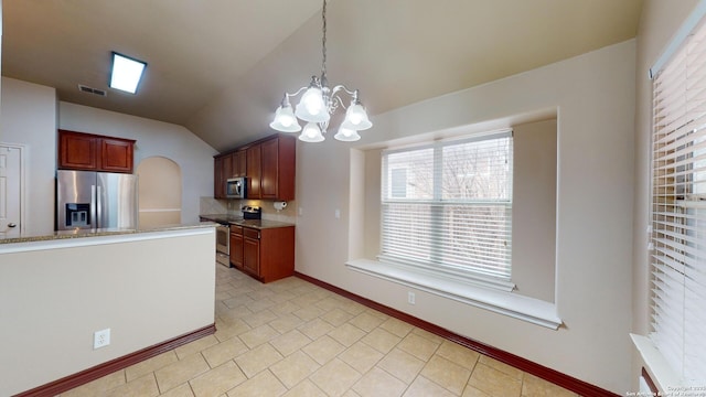 kitchen with pendant lighting, appliances with stainless steel finishes, lofted ceiling, a notable chandelier, and light tile patterned floors