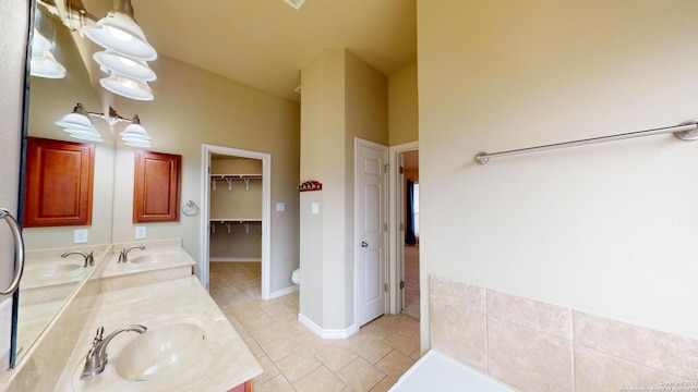 bathroom featuring toilet, vanity, and tile patterned flooring