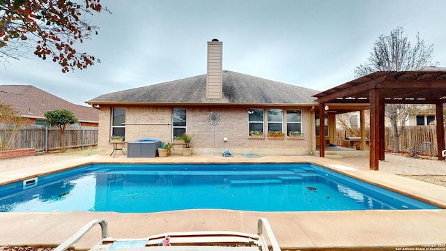 view of swimming pool featuring a patio area and a pergola