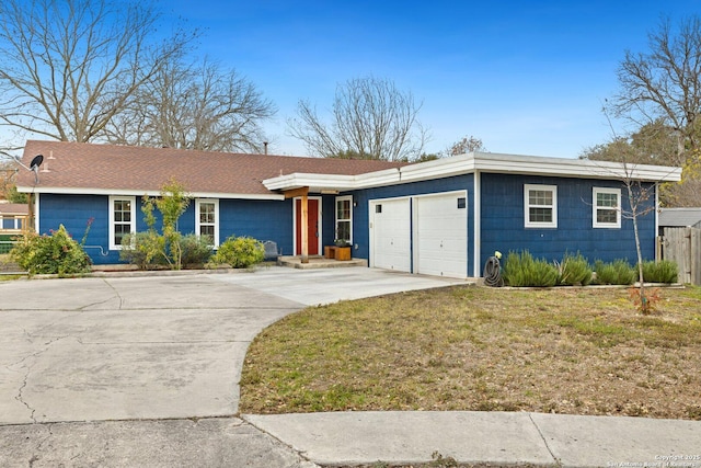 ranch-style house with a front lawn and a garage