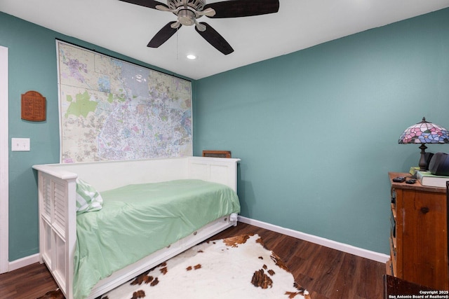 bedroom featuring dark wood-type flooring and ceiling fan