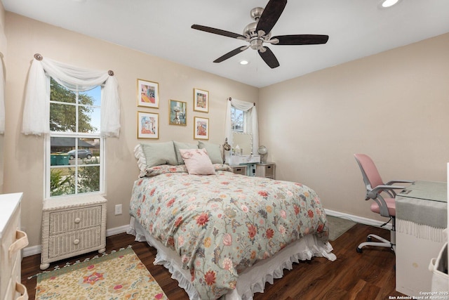 bedroom with ceiling fan and dark hardwood / wood-style floors