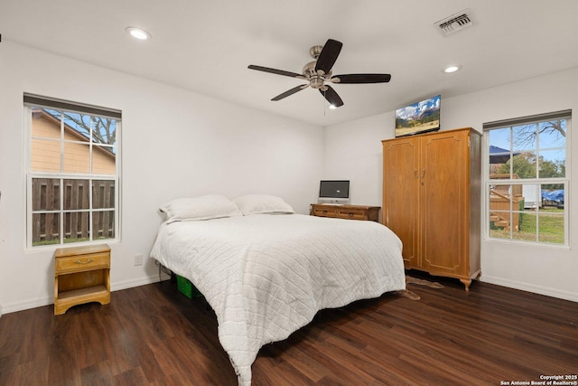 bedroom featuring ceiling fan and dark hardwood / wood-style floors