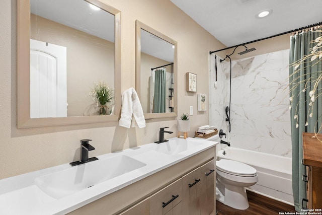 full bathroom featuring toilet, vanity, wood-type flooring, and shower / bath combo with shower curtain