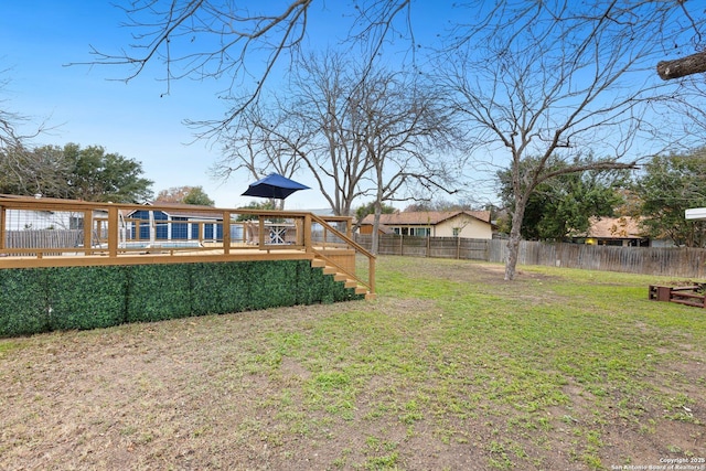 view of yard featuring a wooden deck