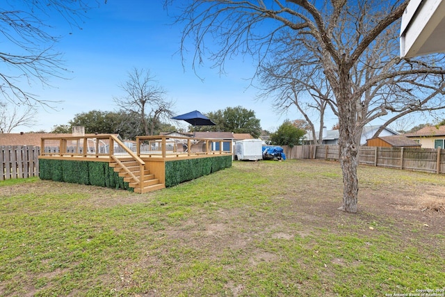 view of yard with a wooden deck