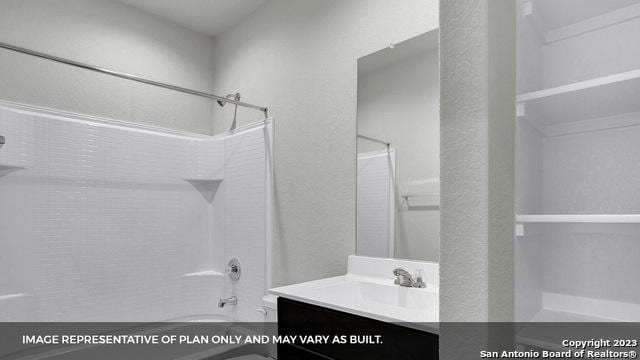 bathroom featuring vanity and shower / tub combination