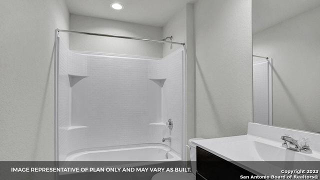 bathroom with vanity and shower / washtub combination