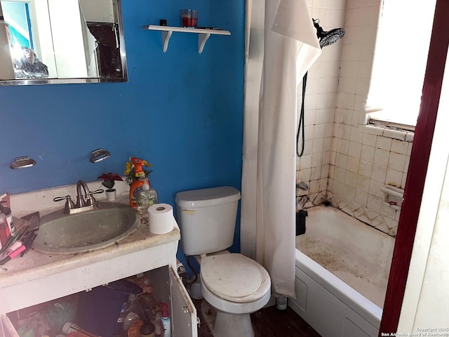 full bathroom with toilet, vanity, and shower / tub combo