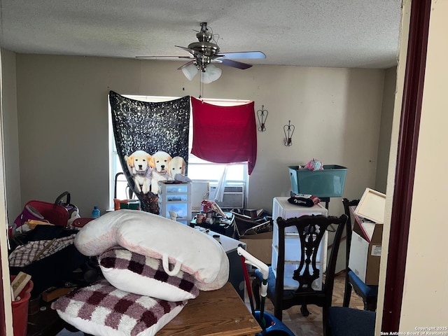 bedroom with ceiling fan, a textured ceiling, and cooling unit