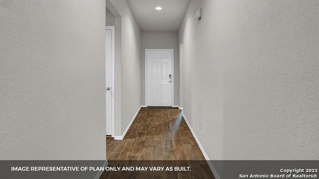 hall with dark hardwood / wood-style flooring