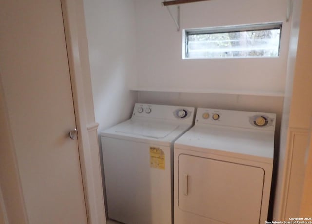 clothes washing area featuring washing machine and dryer