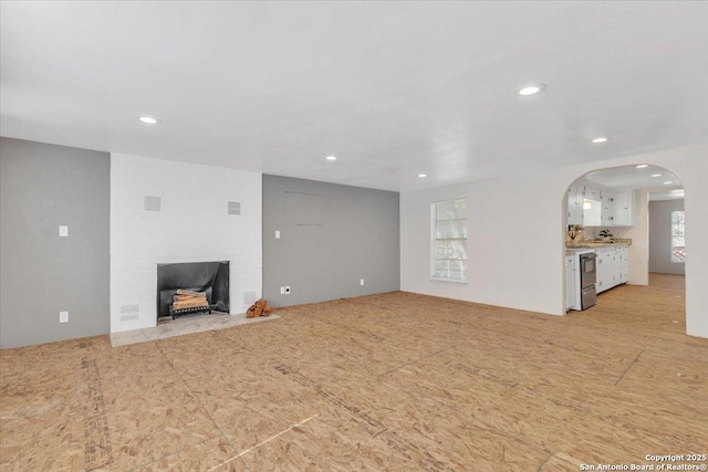 unfurnished living room with a fireplace