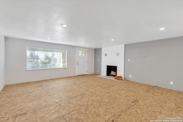 unfurnished living room with a fireplace