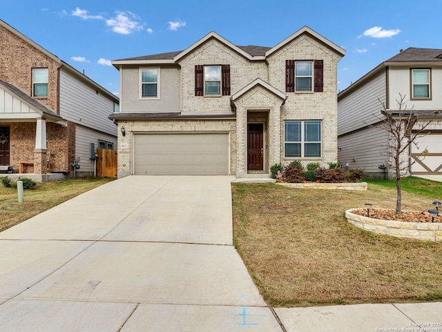 view of front of home featuring a front lawn and a garage