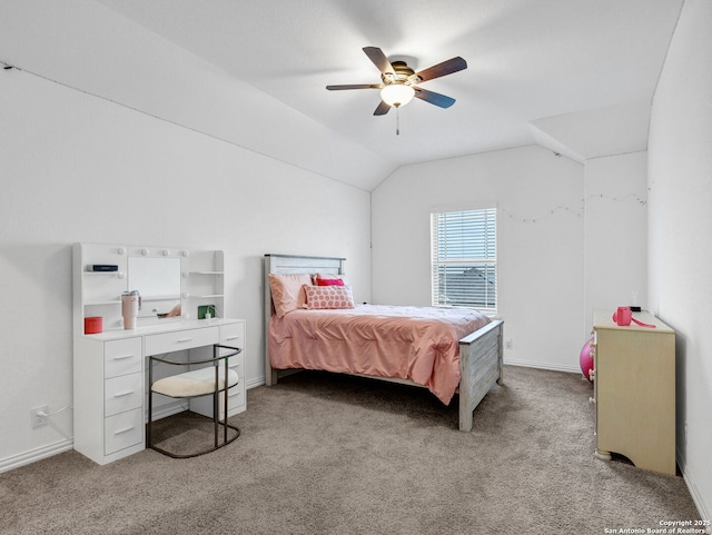 bedroom with vaulted ceiling, ceiling fan, and light carpet