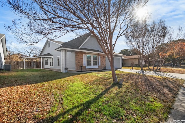 view of front of property featuring central AC unit, a front yard, and a garage