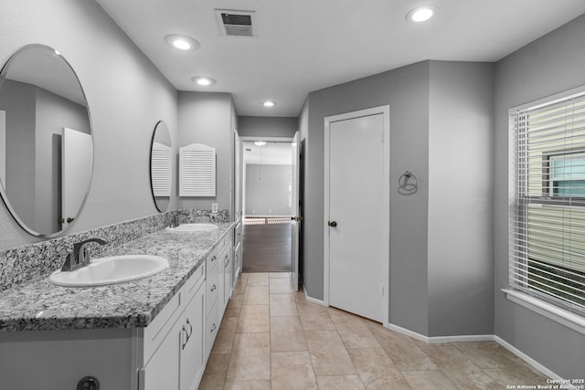 bathroom with vanity and tile patterned floors