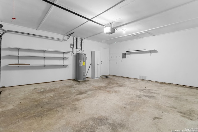 garage with electric water heater and a garage door opener