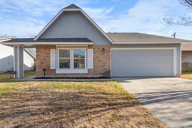 view of front of house with a front lawn and a garage