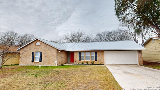 ranch-style house with a garage and a front yard