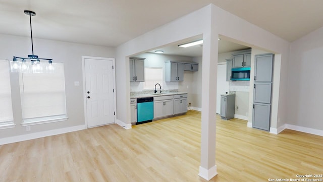 kitchen with sink, dishwasher, plenty of natural light, and light hardwood / wood-style flooring