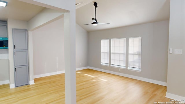 unfurnished living room featuring ceiling fan and hardwood / wood-style floors