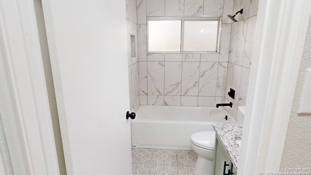 full bathroom with toilet, tile patterned flooring, tiled shower / bath combo, and vanity