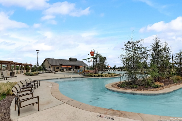 view of swimming pool with a patio