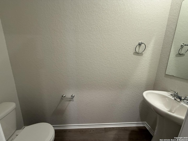 bathroom featuring toilet