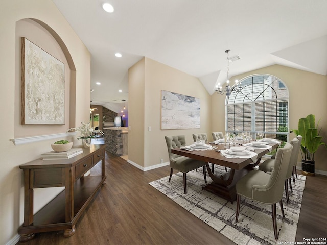 dining space with an inviting chandelier, dark hardwood / wood-style flooring, and lofted ceiling