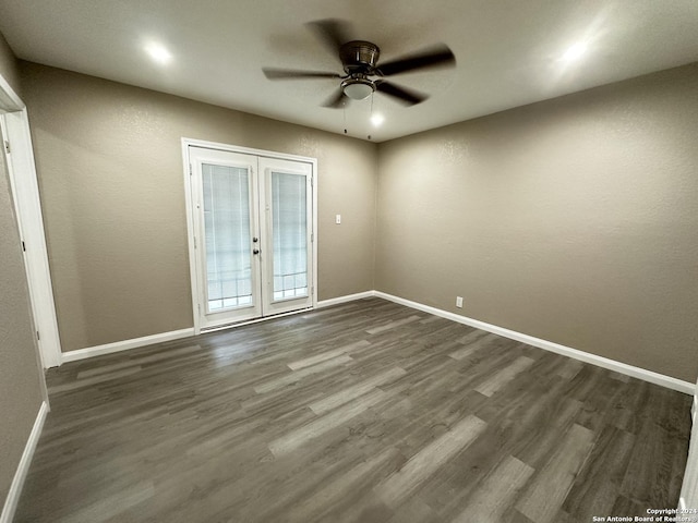 unfurnished room featuring dark wood-type flooring, ceiling fan, and french doors